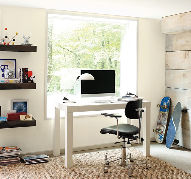 Home office painted in white with wood accent wall. Home office painted in white with wood accent wall.