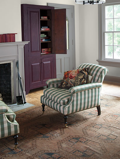 Two distinct gray paint colours yield different undertones in a traditional family room. Two distinct gray paint colours yield different undertones in a traditional family room.