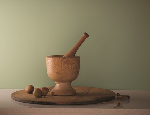 Fernwood green wall with wood mortar and pestle set on a lazy susan. Fernwood green wall with wood mortar and pestle set on a lazy susan.