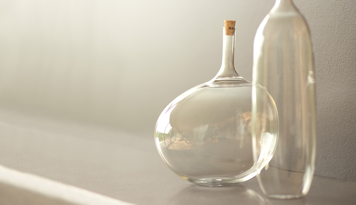 Glass vases set against a wall painted in light griege Barren Plain 2111-60.