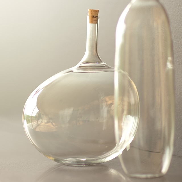 Glass vases set against a wall painted in light griege Barren Plain 2111-60.