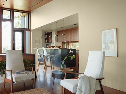 A neutral wood-based kitchen opens to an inviting living room A neutral wood-based kitchen opens to an inviting living room