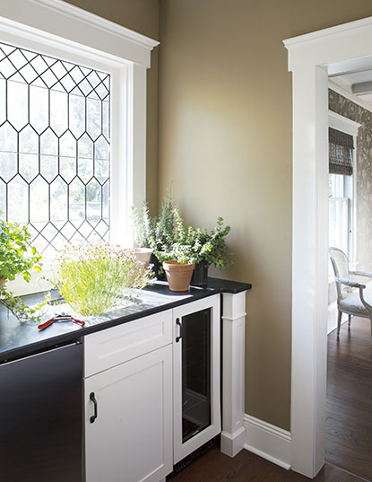 A corner pantry with Hancock Gray HC-97 walls and White Dove OC-17 cabinets. A corner pantry with Hancock Gray HC-97 walls and White Dove OC-17 cabinets.