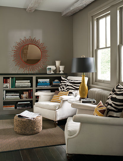 A cozy living room corner with two wing chairs and walls painted in Sparrow AF-720, a deep taupe color. A cozy living room corner with two wing chairs and walls painted in Sparrow AF-720, a deep taupe color.