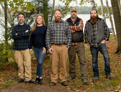 The 5-person cast of Maine Cabin Masters, who also own the Kennebec Cabin Company, pose in the woods. The 5-person cast of Maine Cabin Masters, who also own the Kennebec Cabin Company, pose in the woods.