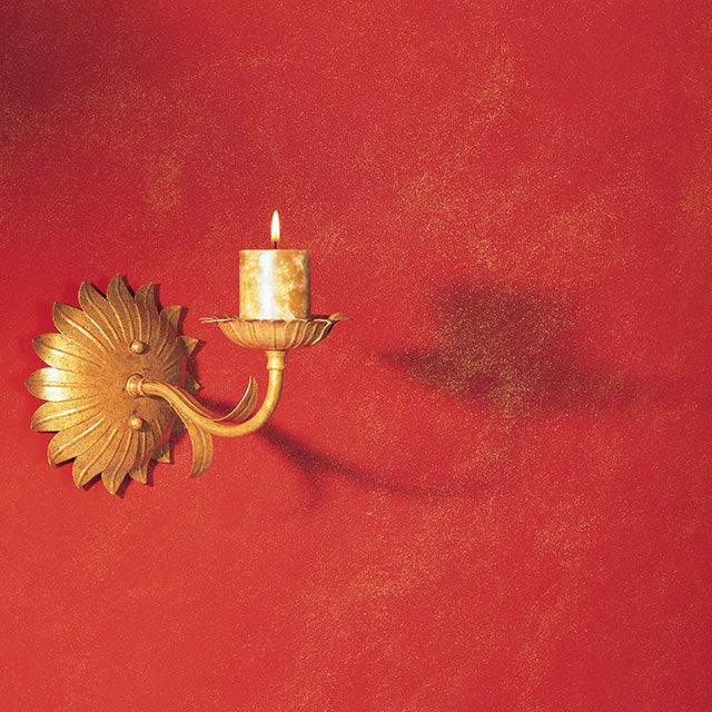 Red glitter wall with gold accents. Red glitter wall with gold accents.
