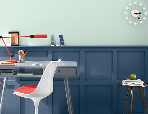Dark blue-painted wainscoting in a contemporary office with desk and chair. Dark blue-painted wainscoting in a contemporary office with desk and chair.