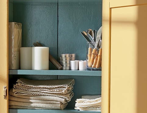 An open cabinet painted in Chestertown Buff HC-9 and Aegean Teal 2136-40. An open cabinet painted in Chestertown Buff HC-9 and Aegean Teal 2136-40.