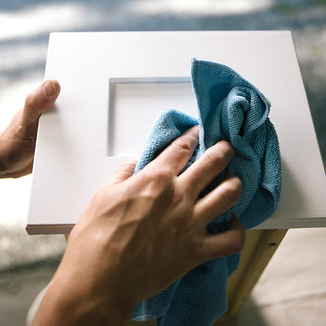 Clean surface of bathroom vanity with a microfiber towel. Clean surface of bathroom vanity with a microfiber towel.