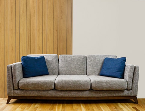 Before and after composite of a room with painted wood paneling. Before and after composite of a room with painted wood paneling.