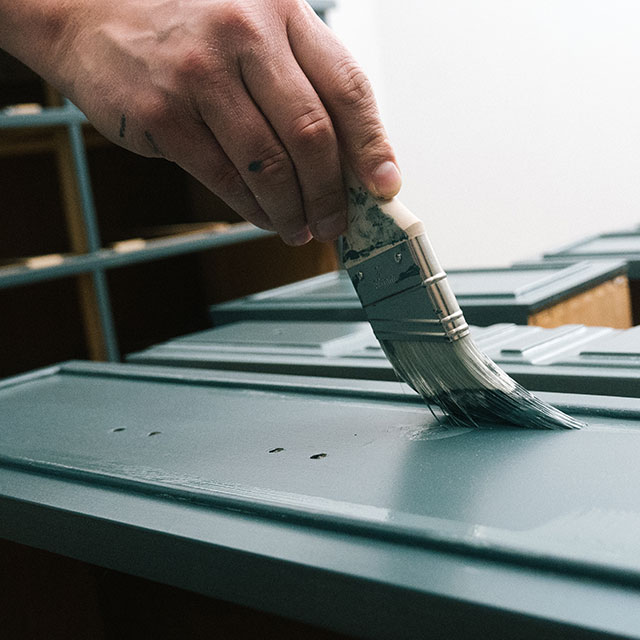 Close up surface of a cabinet is painted green. Close up surface of a cabinet is painted green.