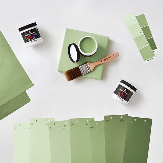An open can of paint color sample and an array of color swatches.