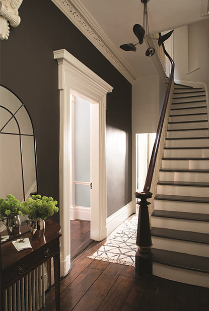Hallway painted in deep brown paint color with eggshell finish Hallway painted in deep brown paint color with eggshell finish