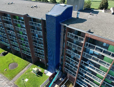 An apartment complex in the process of exterior painting with Benjamin Moore paints.