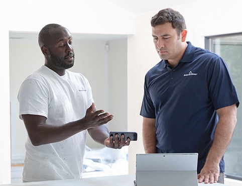 Painting contractors reviewing an estimate. Painting contractors reviewing an estimate.